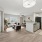 Open concept living room and kitchen with large entryway