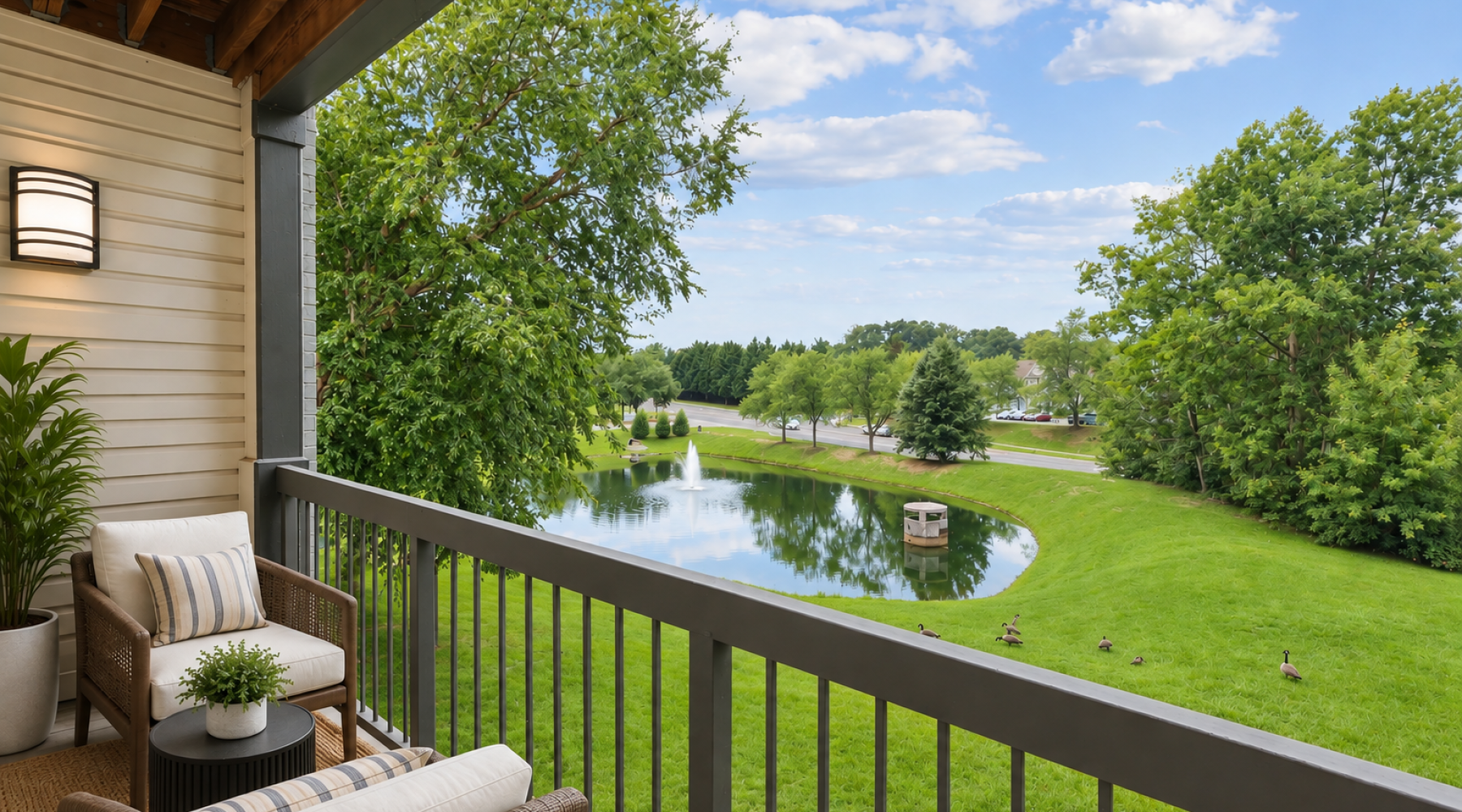 Balcony with plush seating and view of lake