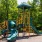 a playground with yellow and green slide