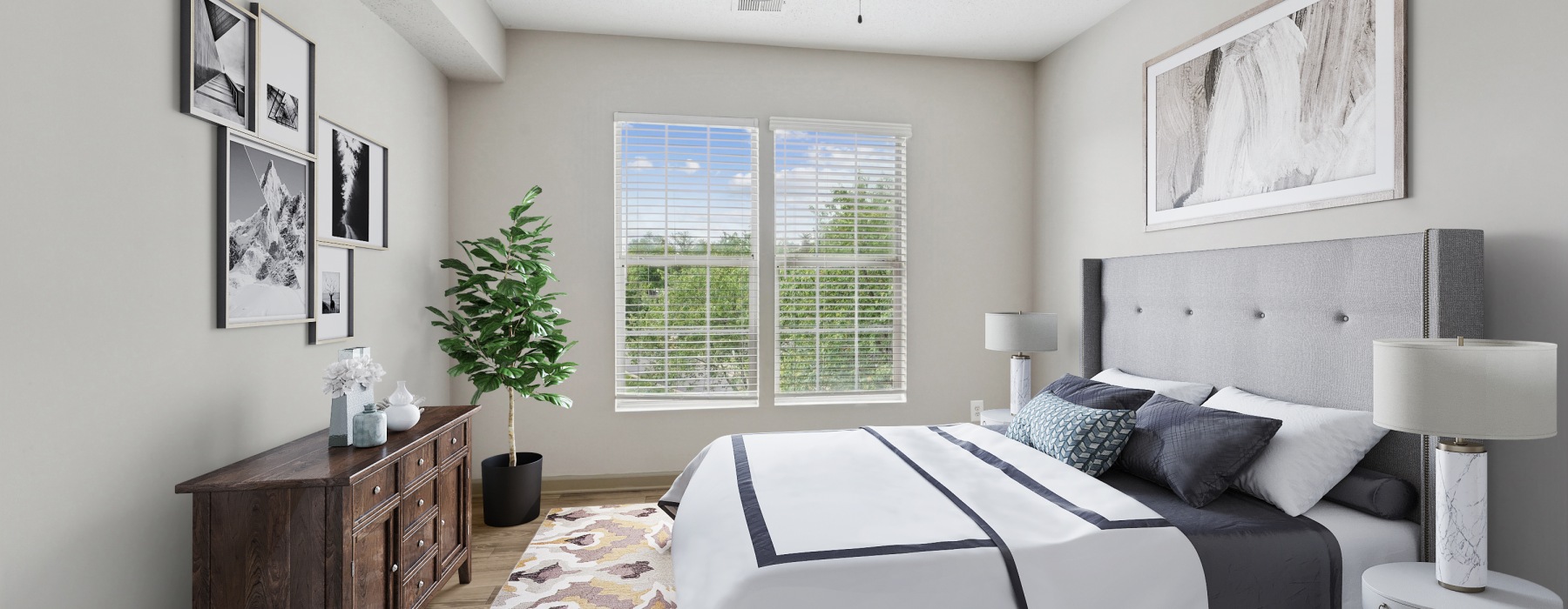 a bedroom with a bed and a fan